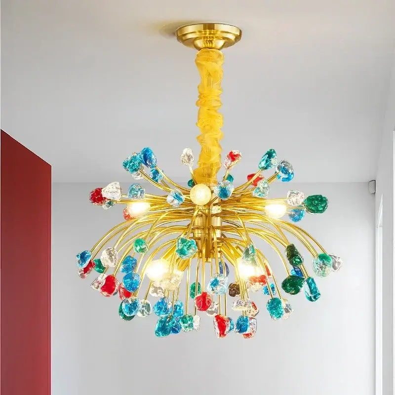 A vibrant golden decorbites crystal chandelier lighting fixture with twisted stem and colorful beads for dining room and kitchen island