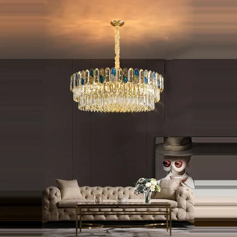 Gold-toned decorbites crystal chandelier led lighting with cascading crystal droplets and blue-tinted glass panels for living room