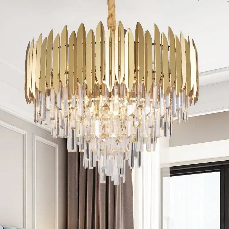 Gold-toned decorbites crystal chandelier pendant light with circular metallic blades and cascading clear crystal prisms