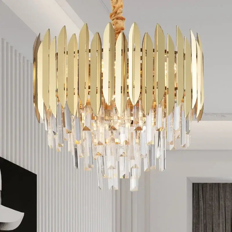 Gold-toned decorbites crystal chandelier pendant light with vertical metallic blades and cascading crystal droplets for living room