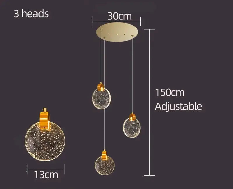 Gold-toned decorbites crystal chandelier pendant light with three spherical glass heads and starry interior design