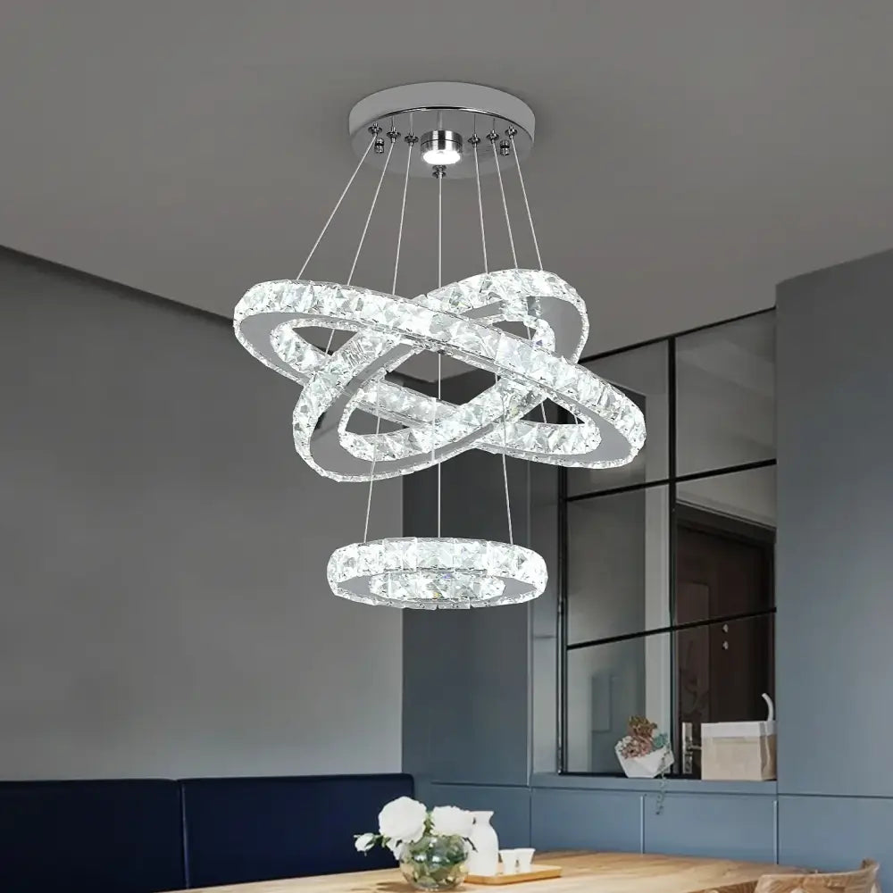 Modern decorbites crystal chandelier led pendant with three interlocking faceted crystal rings and chrome mount for living room