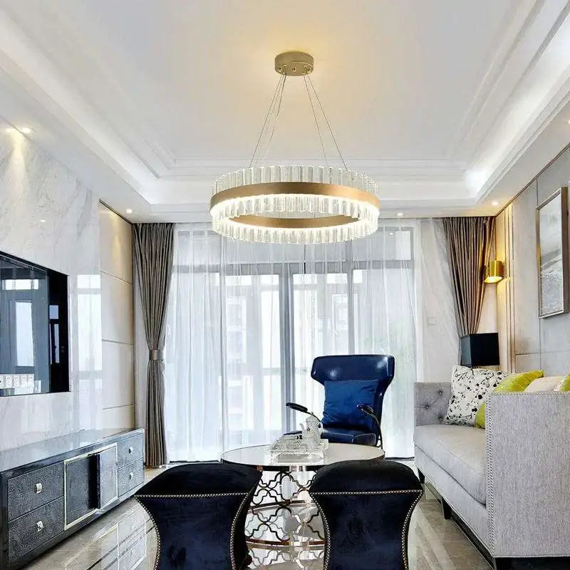 A modern decorbites crystal chandelier led ring with gold-toned frame and clear crystal accents for dining living room and bedroom