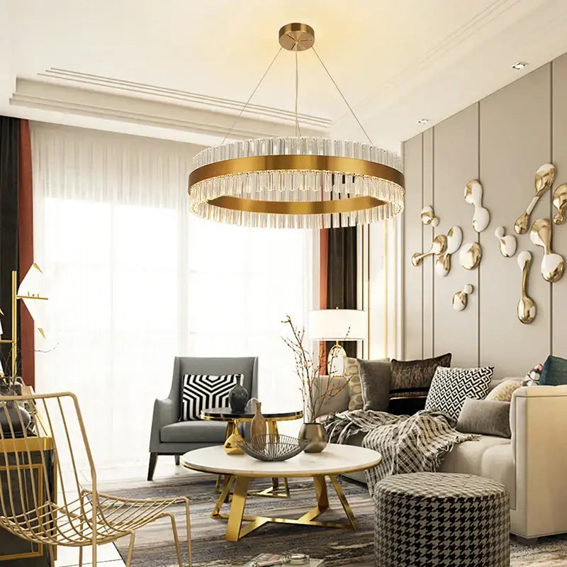 A modern decorbites crystal chandelier led ring with gold metal frame and hanging crystal droplets for dining room