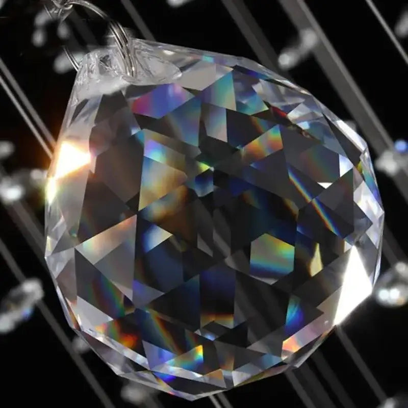 Clear faceted crystal sphere with rainbow prismatic reflections in DecorBites crystal chandelier LED round lamp for luxury decor