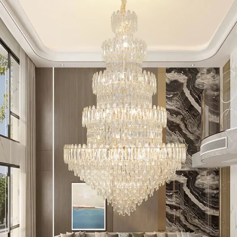 A decorbites crystal chandelier light with cascading clear glass prisms and gold-toned accents for elegant rooms