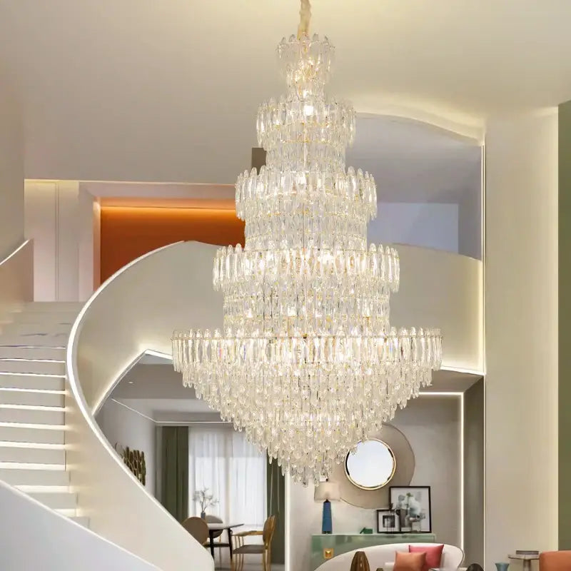 A decorbites crystal chandelier light featuring multi-tiered clear glass prisms and a gold-toned frame for elegant lighting
