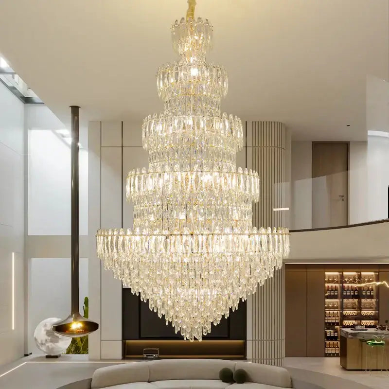 A decorbites crystal chandelier light with golden finish and clear faceted crystals for elegant dining room lighting