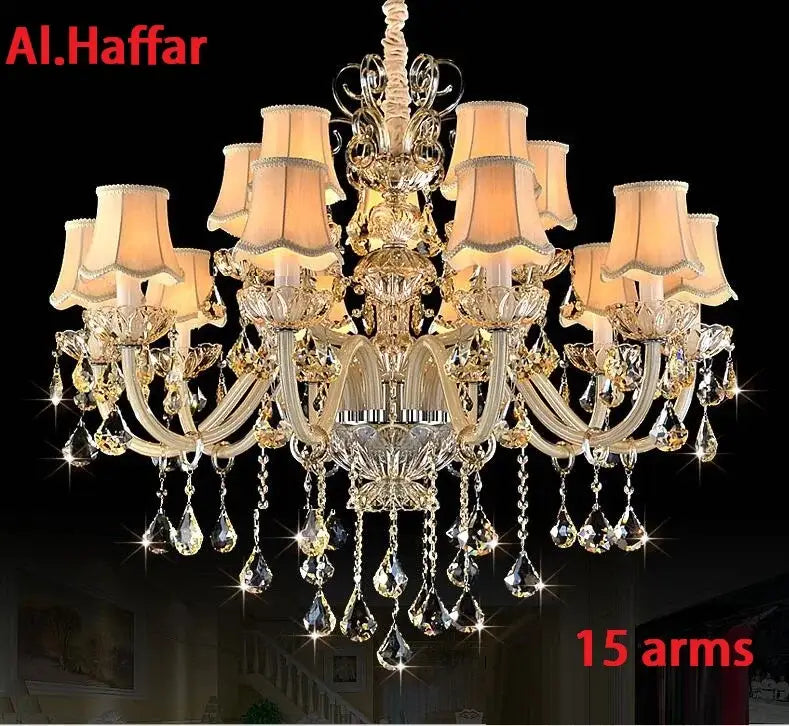 Gold-toned decorbites crystal chandelier light with 15 arms, crystal droplets, and beige lampshades for modern luxury living