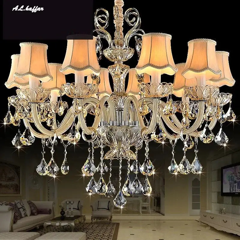 DecorBites crystal chandelier light with gold metal arms, teardrop crystals, and beige lampshades for luxury living rooms