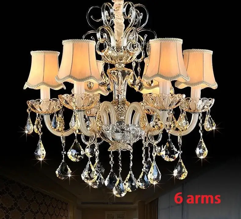 Elegant DecorBites crystal chandelier light featuring six gold-toned arms and teardrop crystals for modern luxury living