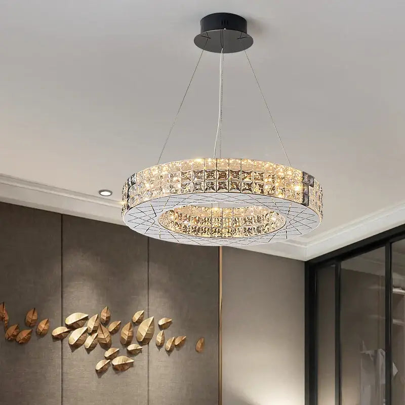 A modern decorbites crystal chandelier with clear crystal facets and black ceiling mount for luxury living room
