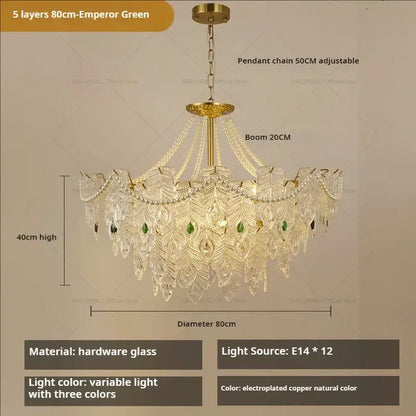 An ornate 80cm decorbites crystal chandelier with five layers of crystal peacock feather design and green gemstone accents