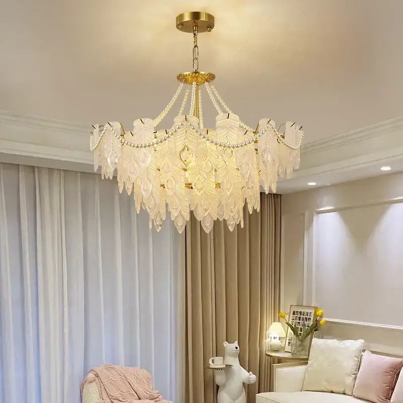 Delicate gold-toned DecorBites crystal chandelier light with feather-shaped glass shades and beaded accents for luxury rooms
