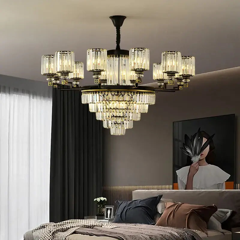A decorbites crystal chandelier light with black metal frame clear crystal prisms and warm cylindrical glass shades