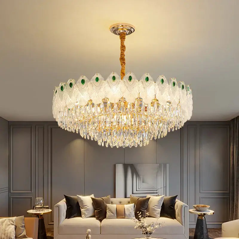 A decorbites crystal chandelier light with gold stem and green accented glass crystals for luxury living rooms