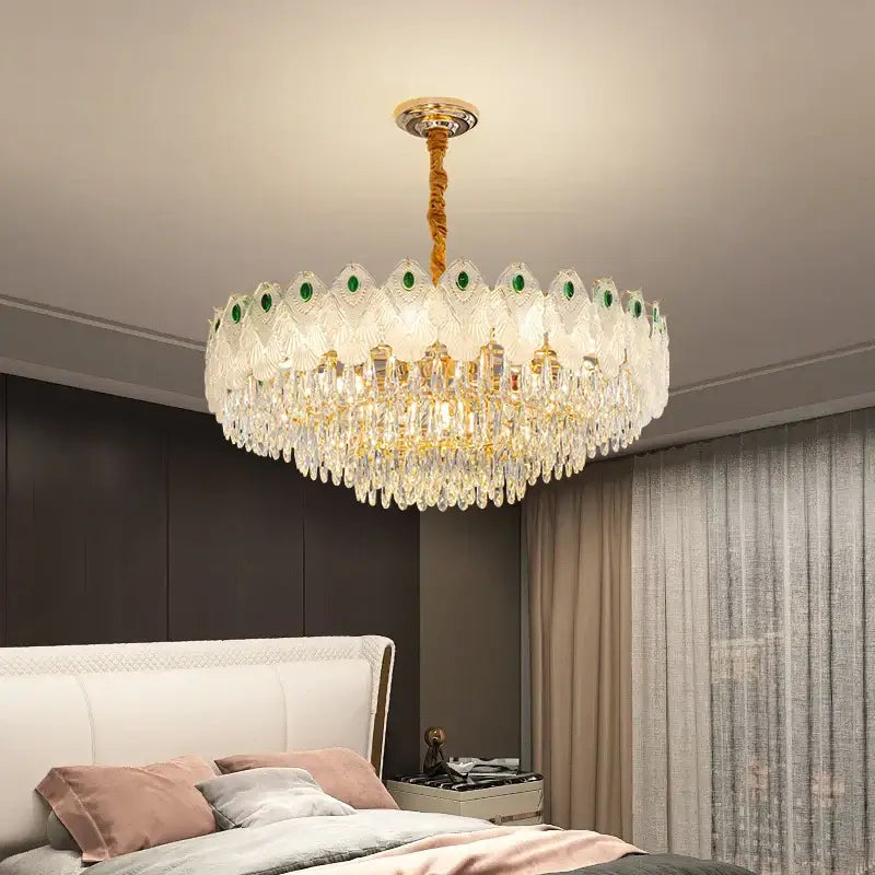 Decorbites crystal chandelier light with gold-toned stem, green gemstone accents, and cascading clear crystals for living room