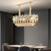 A modern decorbites crystal chandelier light with clear crystal droplets and polished chrome frame for luxury spaces