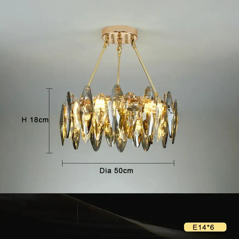 Gold-toned decorbites crystal chandelier light with cascading crystal teardrop pendants and circular brass ceiling mount