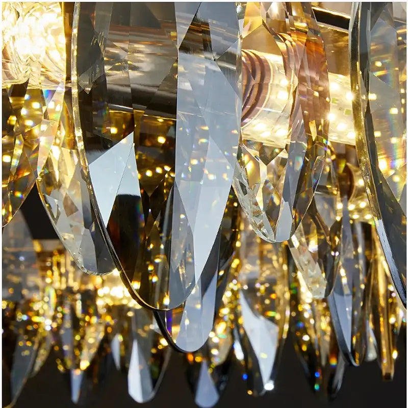 A dazzling gold-toned decorbites crystal chandelier light with faceted crystal droplets for bedroom and living room