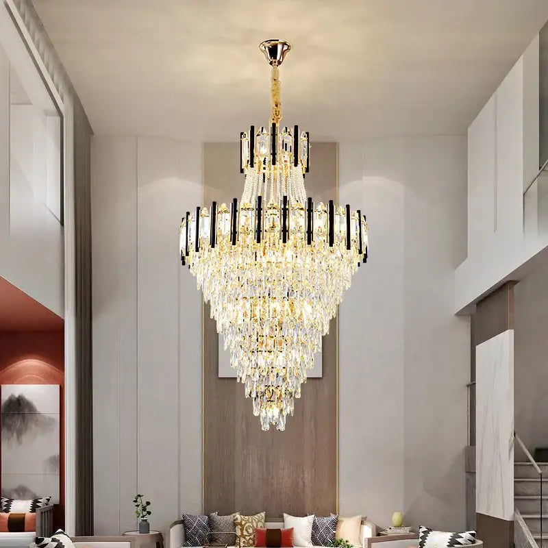 A multi-tiered decorbites crystal chandelier light with gold-toned metal and cascading clear crystals for villa living room luxury