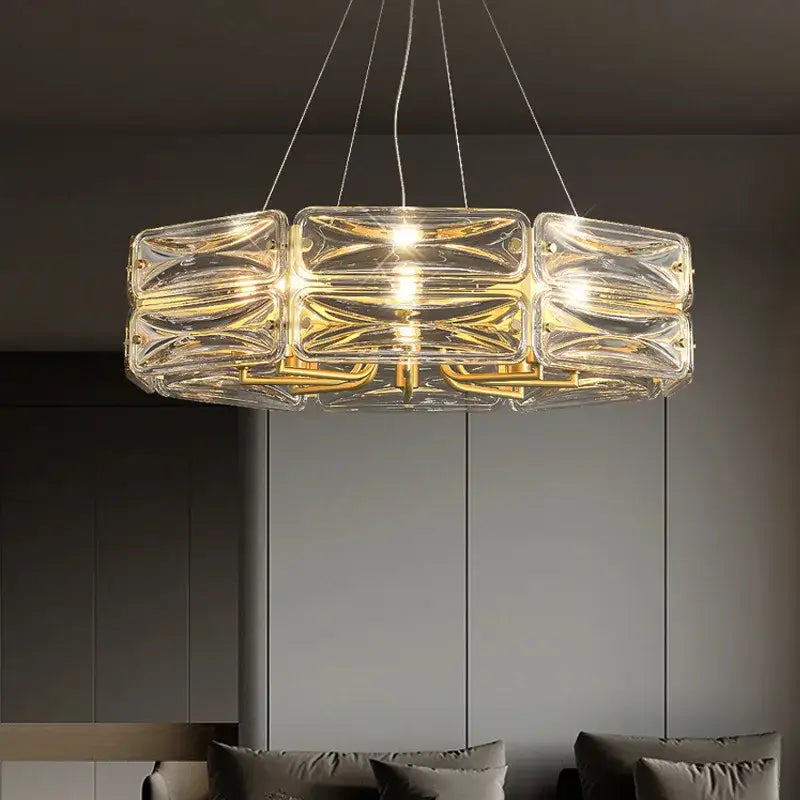 Clear glass decorbites crystal chandelier with gold metal accents and modern geometric design for luxury home lighting