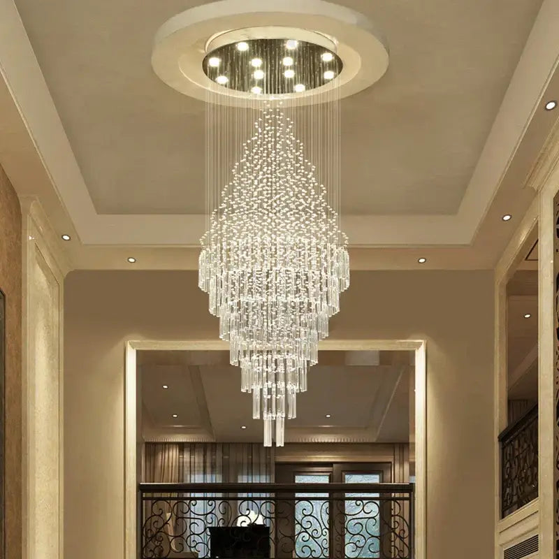 A multi-tiered decorbites crystal chandelier with cascading clear faceted crystals for luxury home decor lighting