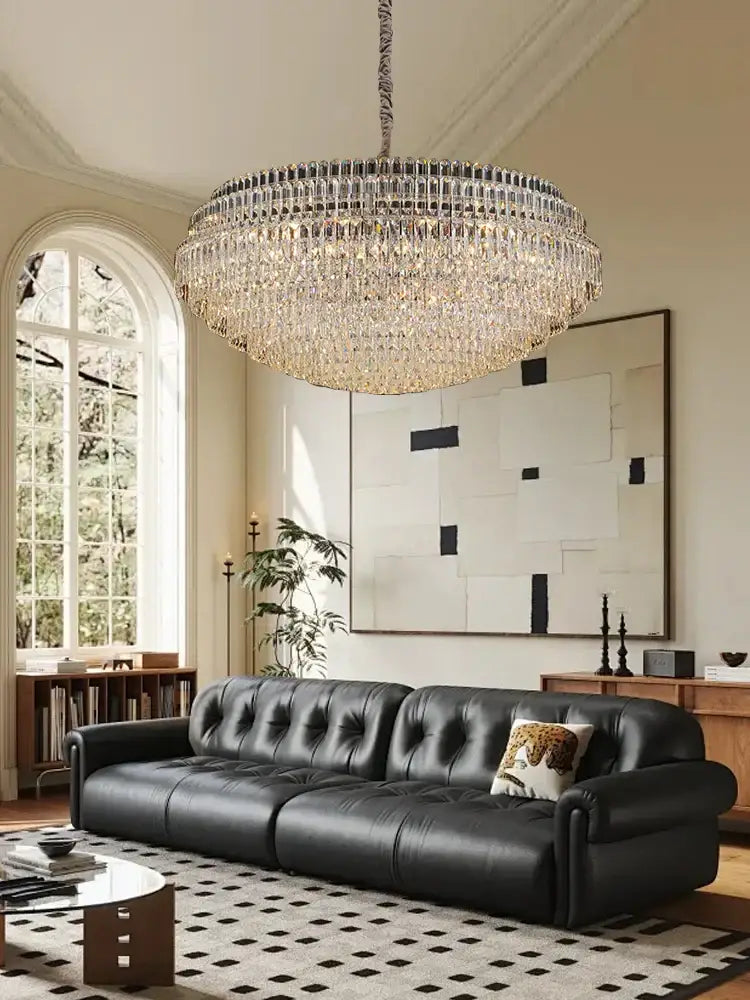 Large circular decorbites crystal chandelier lights featuring clear crystal prisms in concentric rings with metallic chain suspension