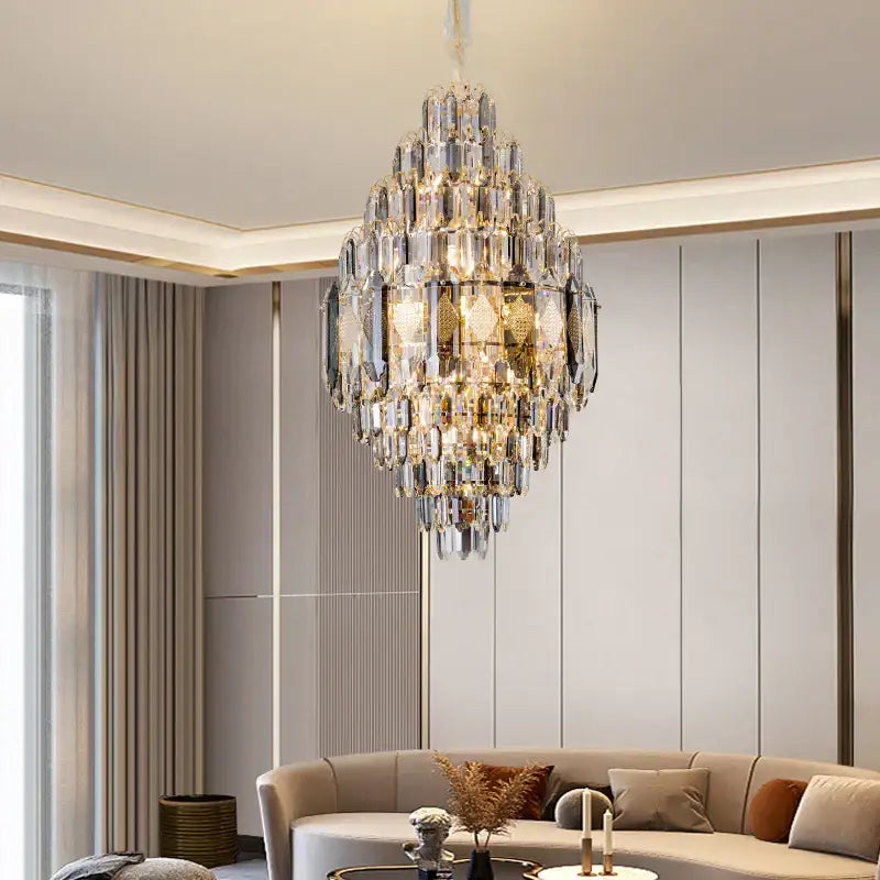 DecorBites crystal chandelier with gold-toned metal and faceted glass prisms for villa hotel and building projects