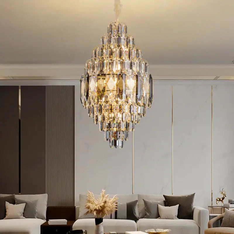 A decorbites crystal chandelier with gold-toned accents and cascading glass prisms for villa hotel and building projects