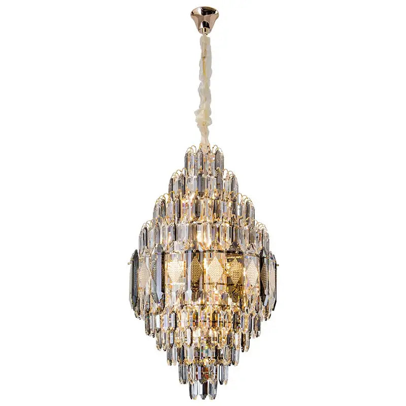 Decorbites crystal chandelier with cascading clear and gold glass prisms suspended from a polished brass fixture