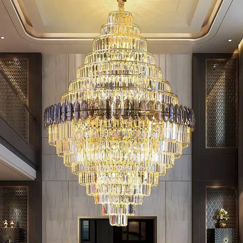 Decorbites crystal chandelier with cascading clear and amber prisms in gold tone for penthouse villa stairwell lighting