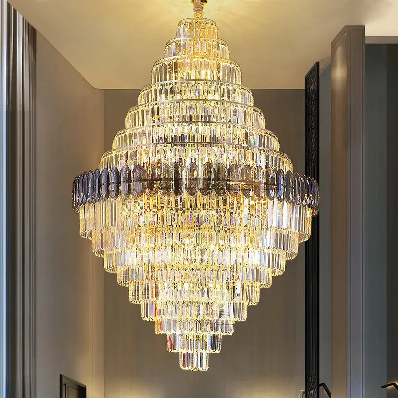 Decorbites crystal chandelier with multi-tiered clear and smoky glass prisms on gold-toned frame for luxe stairwell lighting