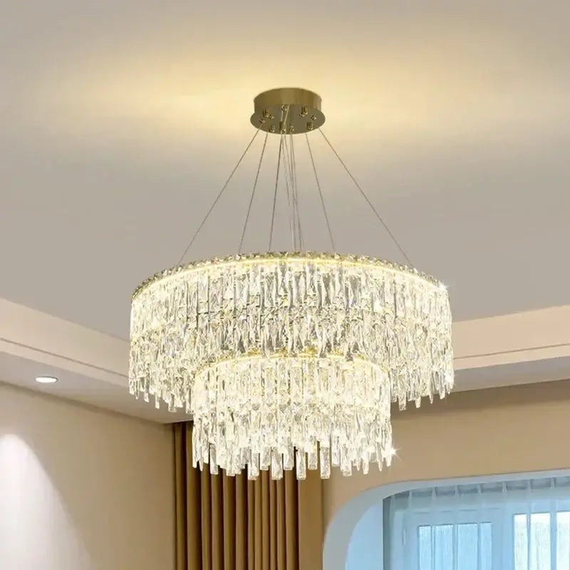 DecorBites crystal chandelier with two tiers of clear glass prisms and gold-toned mount for luxury bedroom lighting