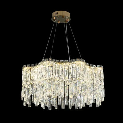 A decorbites crystal chandelier with cascading clear glass prisms and a brushed gold ceiling mount for luxury lighting