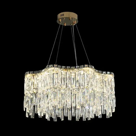 A decorbites crystal chandelier with cascading clear glass prisms and a brushed gold ceiling mount for luxury lighting