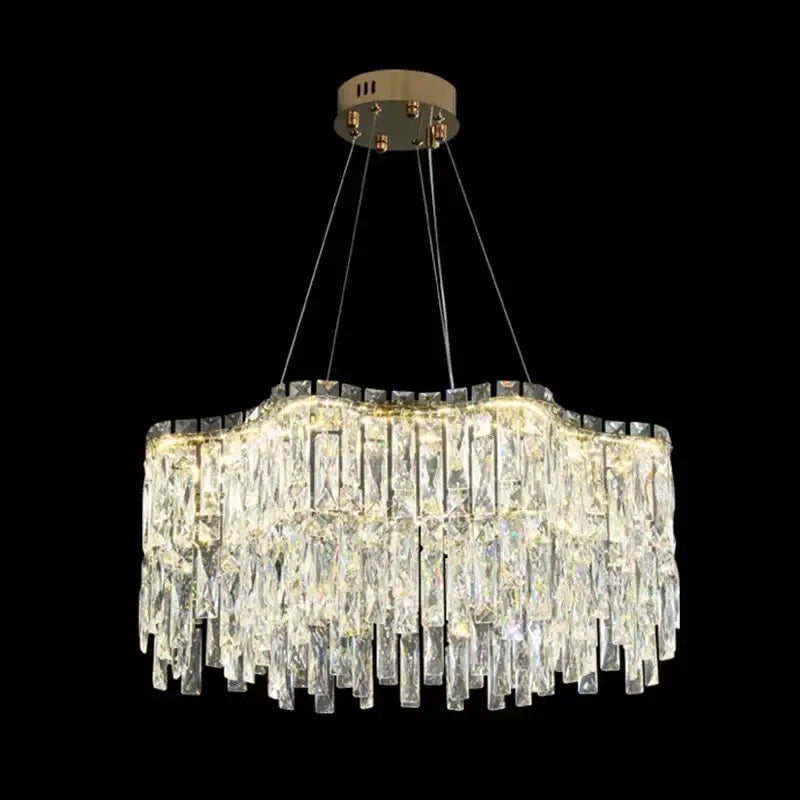 A decorbites crystal chandelier with cascading clear glass prisms and a brushed gold ceiling mount for luxury lighting