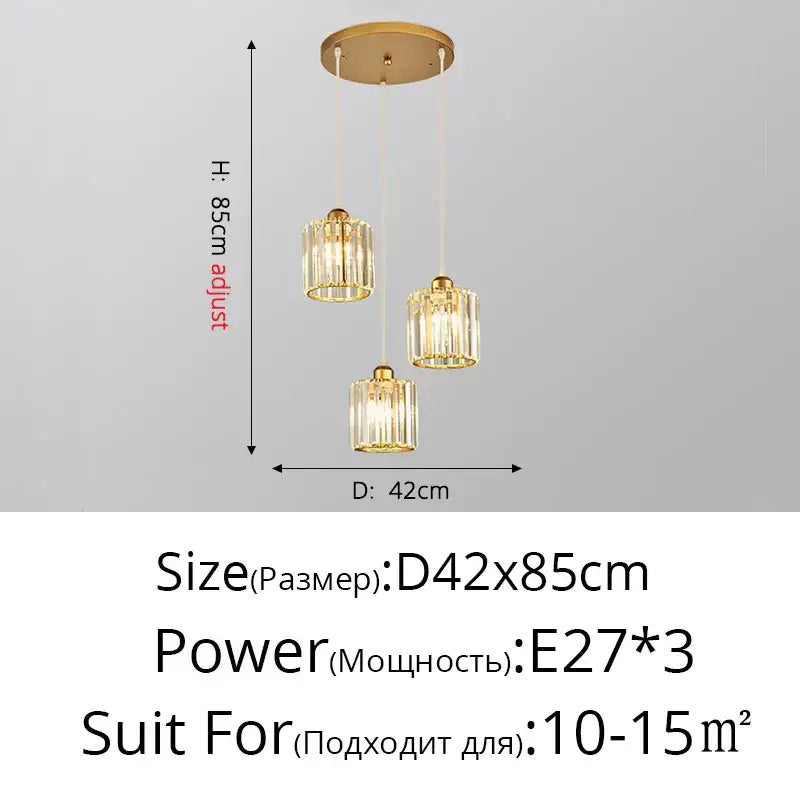 Gold-toned decorbites crystal chandelier pendant light with three cylindrical glass shades and adjustable height for indoor use