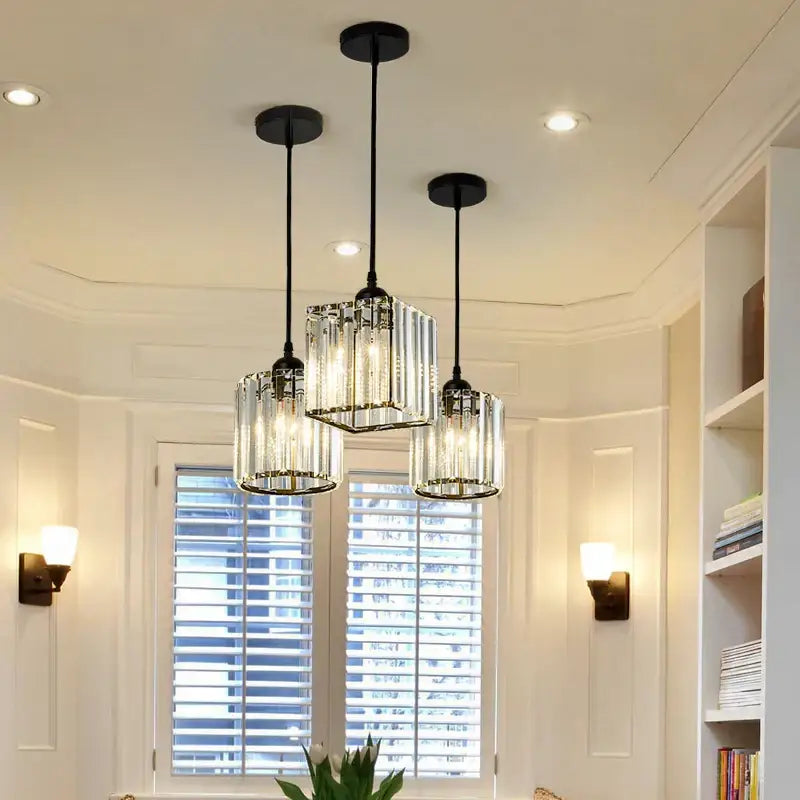 Three modern pendant lights with clear ribbed glass shades and black metal frames from decorbites crystal chandelier