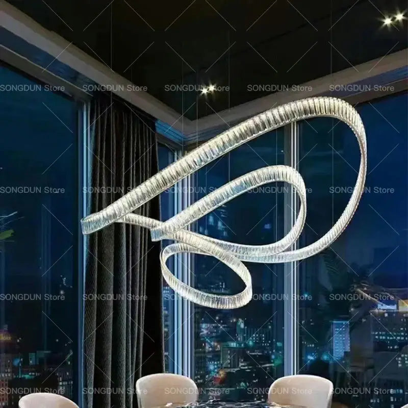 A modern decorbites crystal chandelier with metallic finish and embedded crystals luxury designer light for elegant spaces