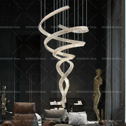 A modern decorbites crystal chandelier with a sleek silver finish and crystal accents for luxury designer light spaces