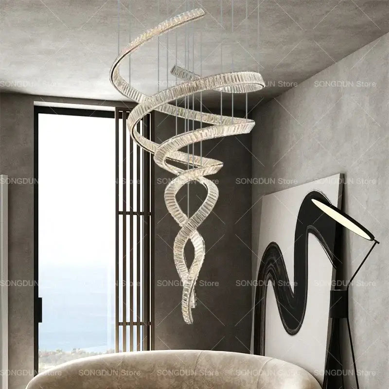 A modern decorbites crystal chandelier with a sleek metallic frame and clear crystals luxury designer light