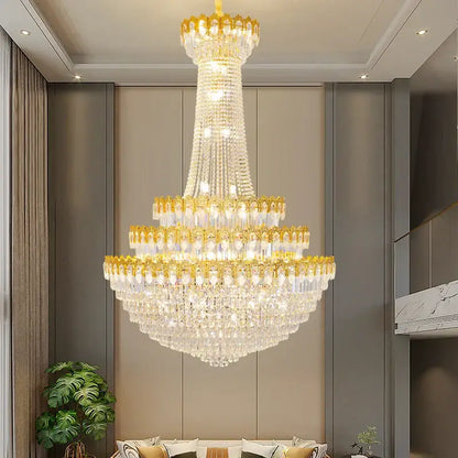 A multi-tiered decorbites crystal chandelier with gold-toned accents and clear crystals for luxury living rooms