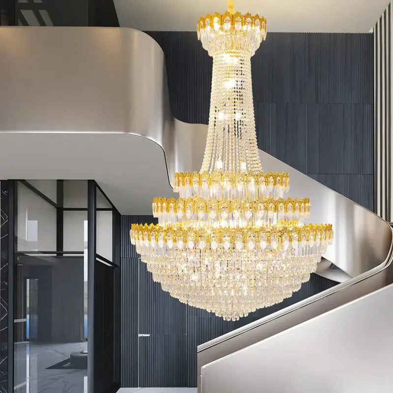 A decorbites crystal chandelier with gold-toned metalwork and cascading clear crystal droplets for luxury living rooms