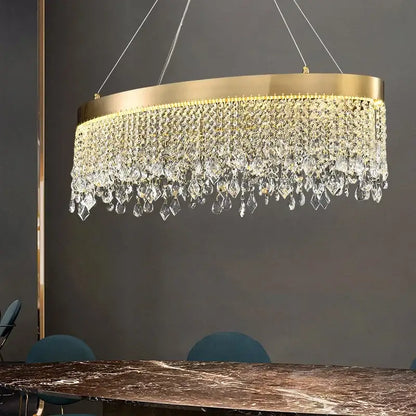 A decorbites crystal chandelier with luxury gold tone and cascading clear crystal droplets for elegant ceiling lighting