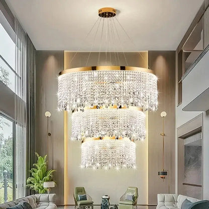 Decorbites crystal chandelier with multi-tiered clear crystals and gold-toned metal in luxury LED ceiling pendant design