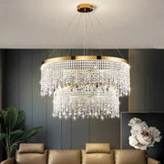 Luxurious decorbites crystal chandelier with tiered gold-toned accents and cascading clear crystals for ceiling lighting