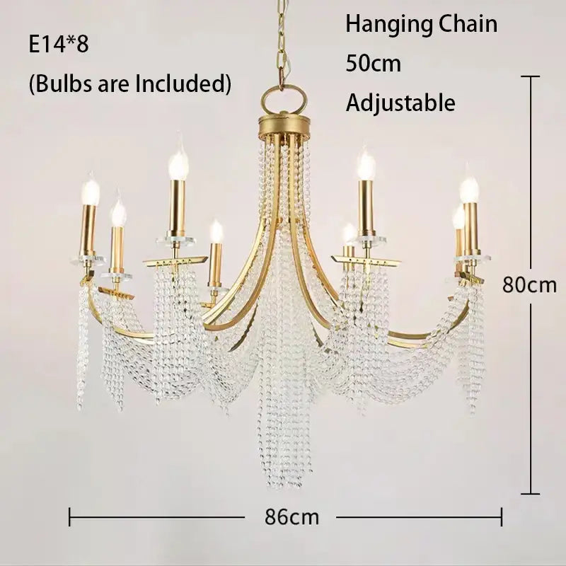 Gold-finished decorbites crystal chandelier with eight candle-style bulbs and cascading clear crystal beads for indoor decor