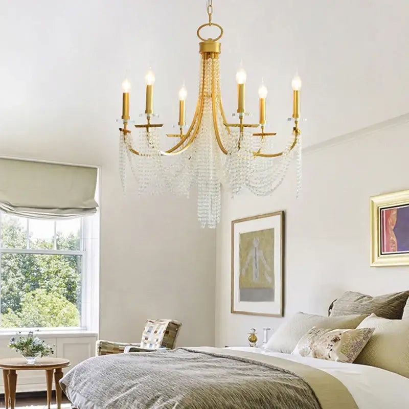 Decorbites crystal chandelier gold-toned with crystal droplets and candle-style bulbs for romantic indoor decor