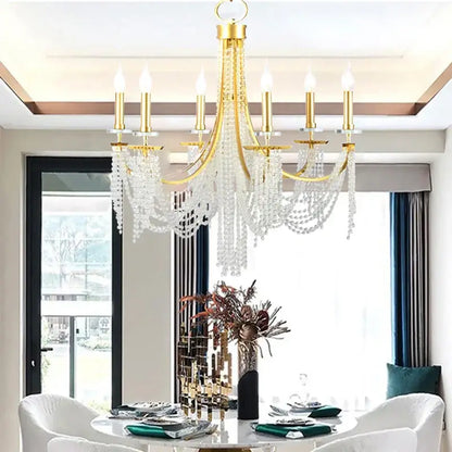 Gold-toned decorbites crystal chandelier with cascading crystal beads and candle-style bulbs for romantic indoor decor